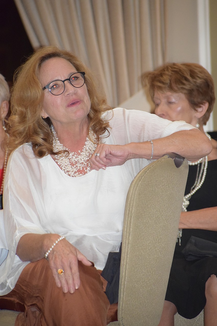 Susanne Barsoumian, a Lakewood Ranch Women's Club member, sings along to 