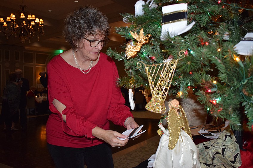 Helene Levin, a co-president of the Lakewood Ranch Women's Club for 2020, collects little stockings with personal donations inside. The club collected 125 donations.