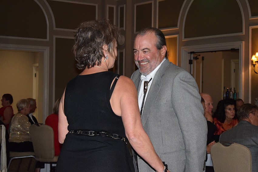 Andy Heeren and Lori Loveberry, of Lakewood Ranch Country Club East, dance together during the charity fundraiser. 