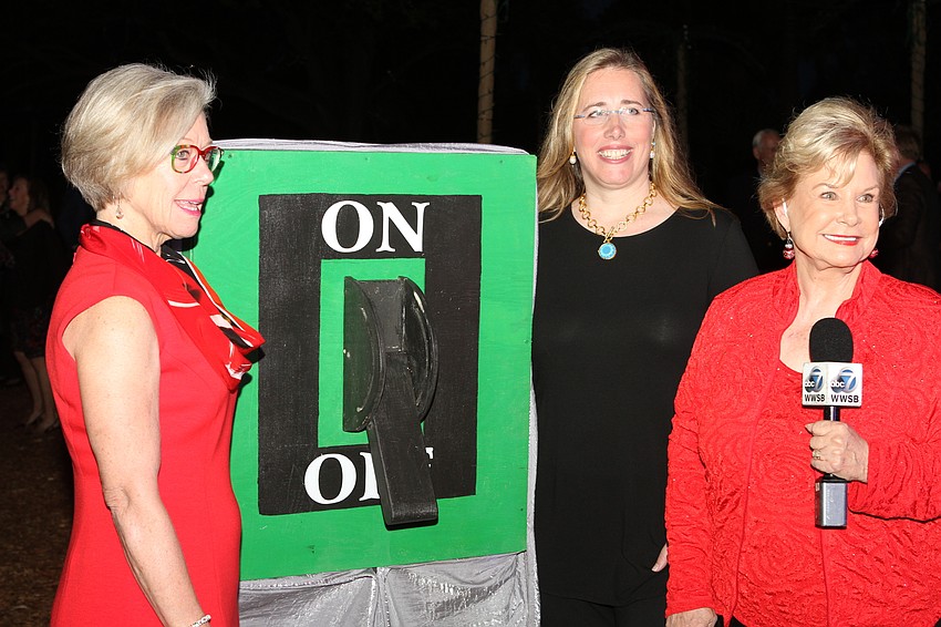 Selby President and CEO Jennifer Rominiecki prepared to flip the switch.