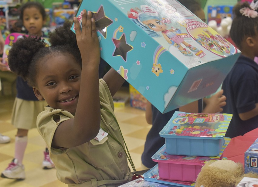 Kiyarah Martin, 5, picks out one of the toys.
