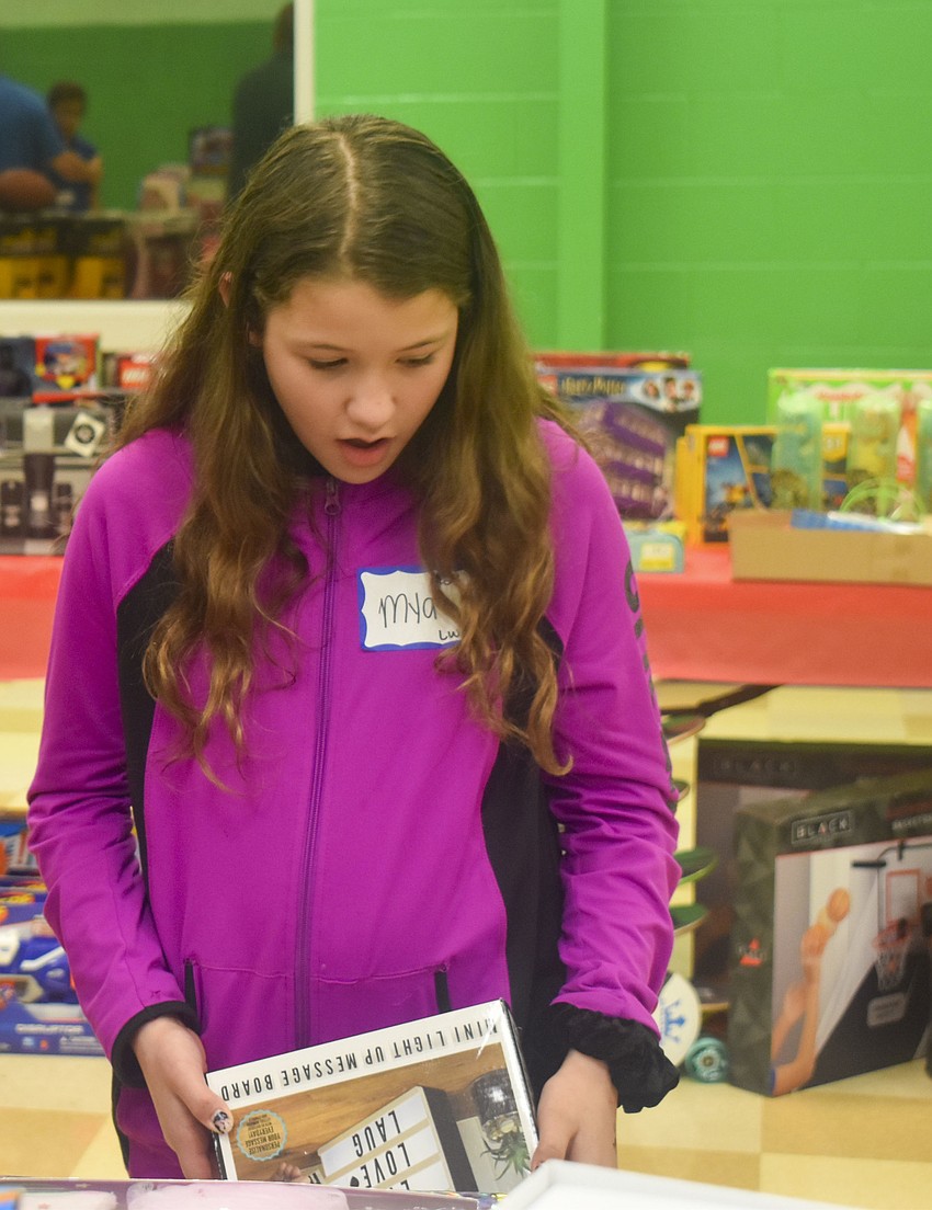 Mya Fernaned, 10, looks at the different gift options.