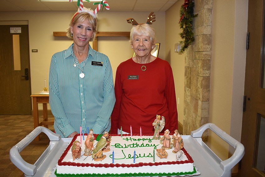Lutie Uihlein and Patty Buck with a birthday cake.
