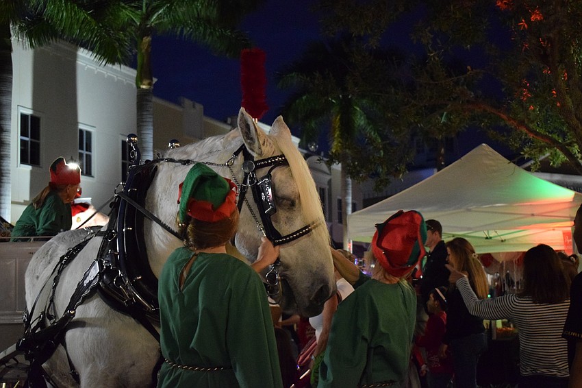 A horse pulls Santa to the Lakewood Ranch Information Center on Main Street at Lakewood Ranch so thousands of kids can visit him and tell him what they want for Christmas.