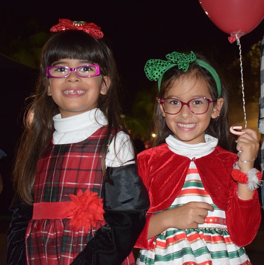 East County's Mia and Nina Zuleta-Lockhart, both 6, wear Christmas dresses to Holidays Around the Ranch.