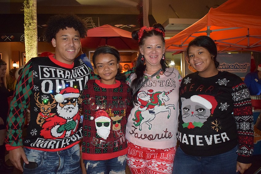 Wearing holiday sweaters is a tradition for Trevon Redmond, Markesha Hardin, April Johnson and Makaela Redmond.