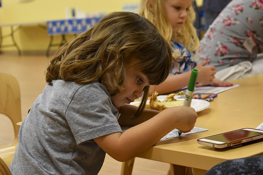 Andrew Dobson, 2, works on his Hanukkah  drawing.