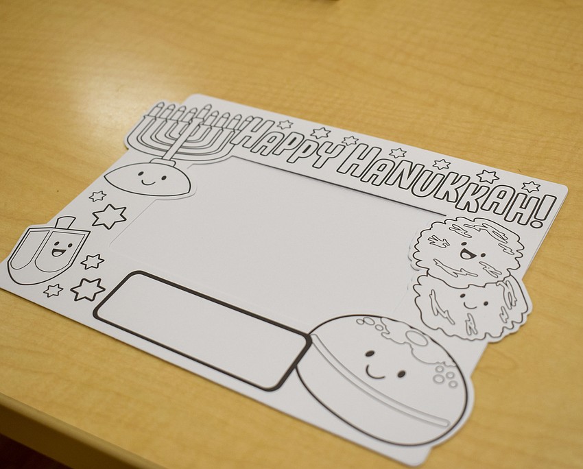 The tots colored their own Hanukkah drawings.