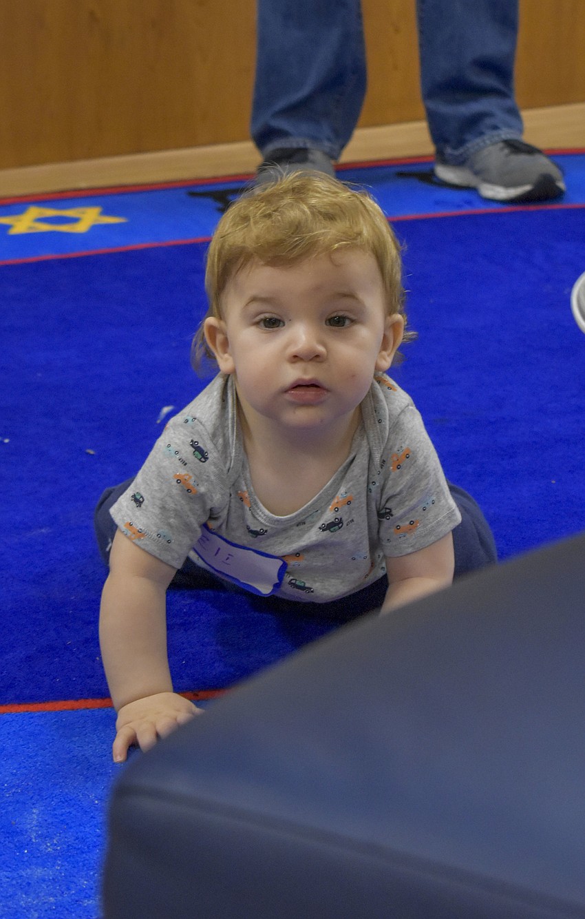 Eli, Haspel, 11 months, crawls around during Shabbat.
