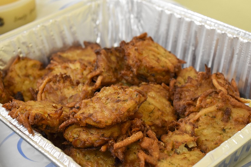 Latkes are one of the foods that the Tot Shabbat offered.