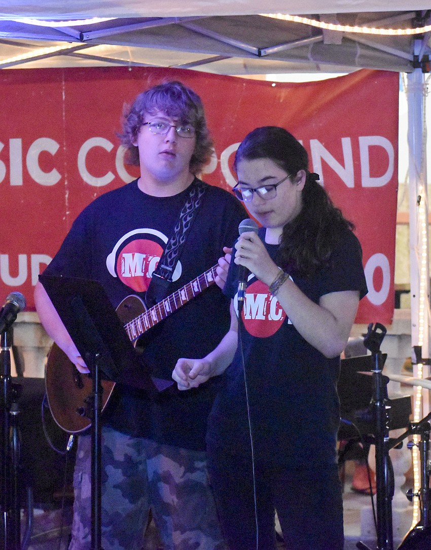 The Music Compound students perform during the holiday stroll.