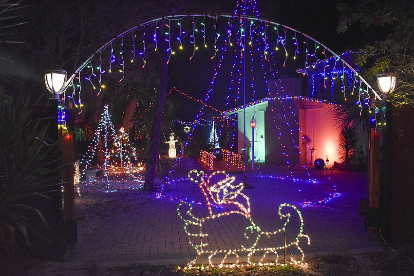 The home at 617 Mangrove Point Road includes many layers in its lights display.