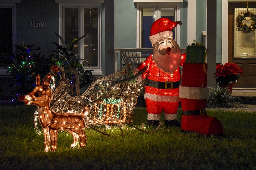 Santa Claus and Rudolph are ready to hop in their sleigh at 1762 North Drive.