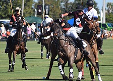 La Estampida/Hillcroft's James Miller (4) tries to connect during the season opener with Scott Doyle right behind him if needed.