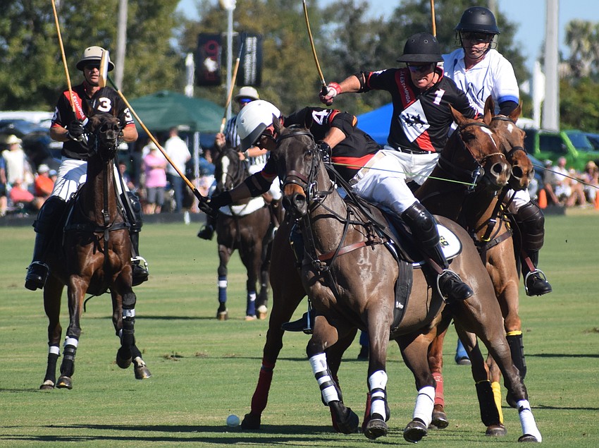 La Estampida/Hillcroft's James Miller (4) tries to connect during the season opener with Scott Doyle right behind him if needed.