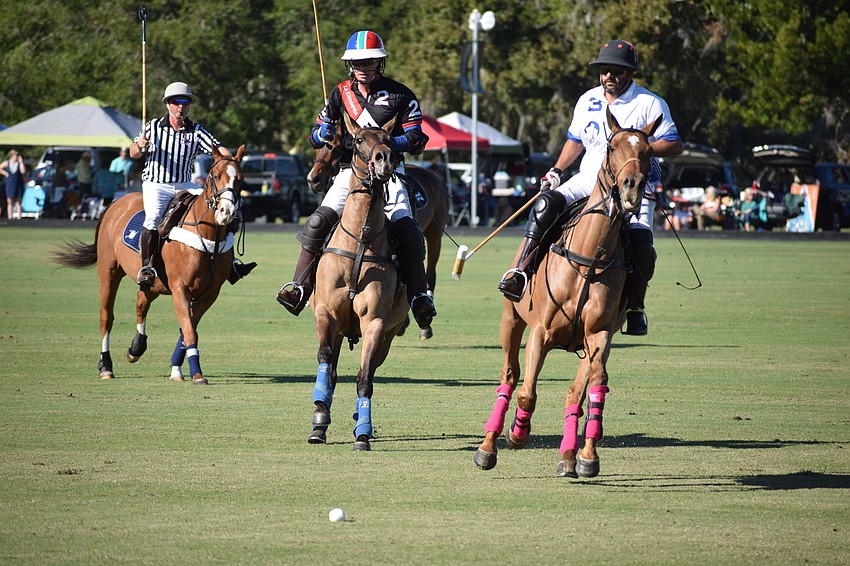 Whiskey Pond/Barefield's Guille Aguero races in front of La Estampida/Hillcroft's Stuart Campbell in the first half of their game.