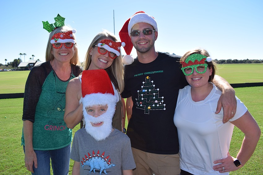 St. Petersburg's Robin Zimmermaker, daughter Kristen Zimmermaker and grandson Aiden Frappier join Heritage Harbour's Mike and Megan Abeigon at opening day.
