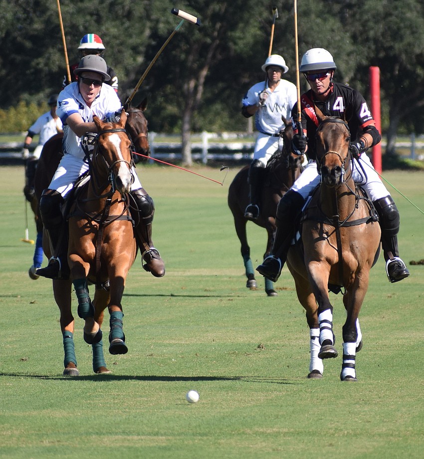 Mark Mulligan of Whiskey Pond/Barefield races againt La Estampida/Hillcroft's James Miller to the ball.