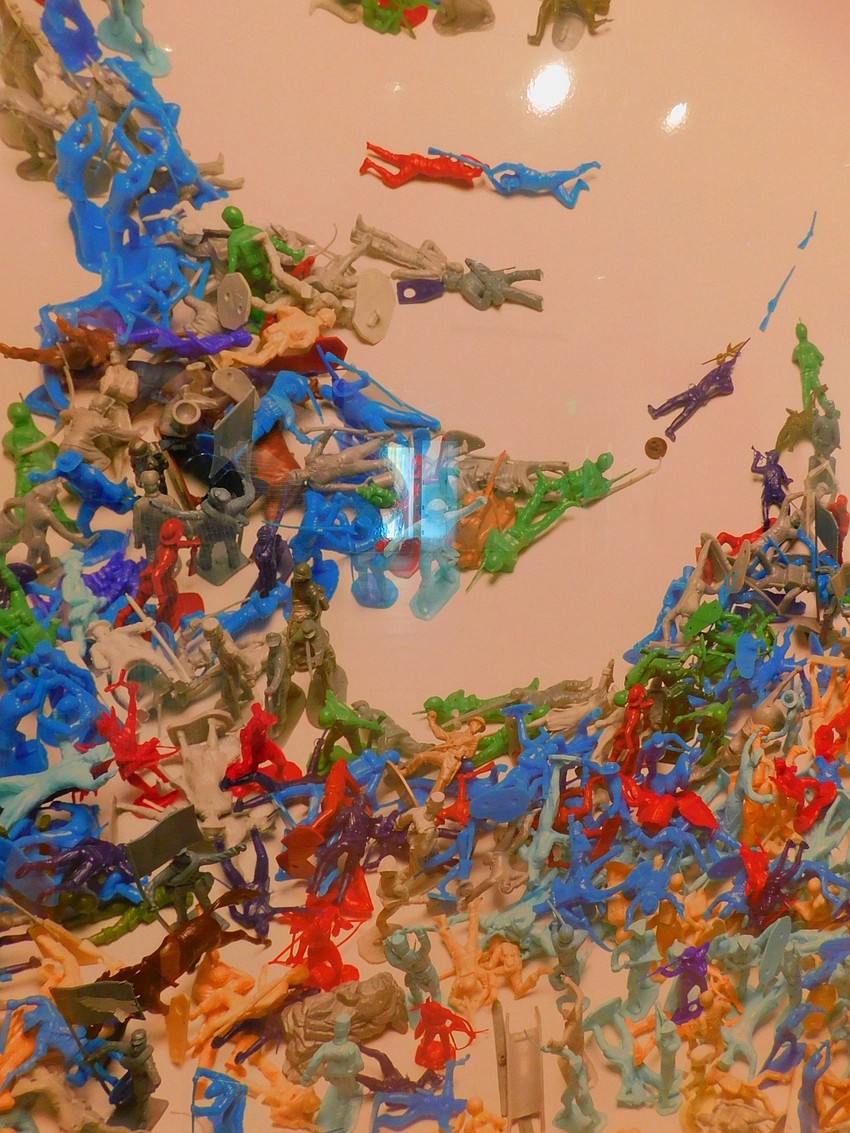 ... a closer look reveals that the portrait is made from hundreds of plastic army men.