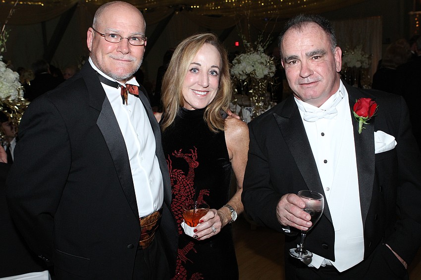 Dr. Mark and Karen Johnson with Kevin Dougherty