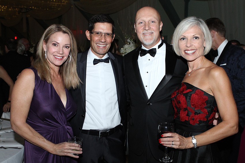 Kristen Farrell and Joern Sroka with Scott and Melissa Stevens