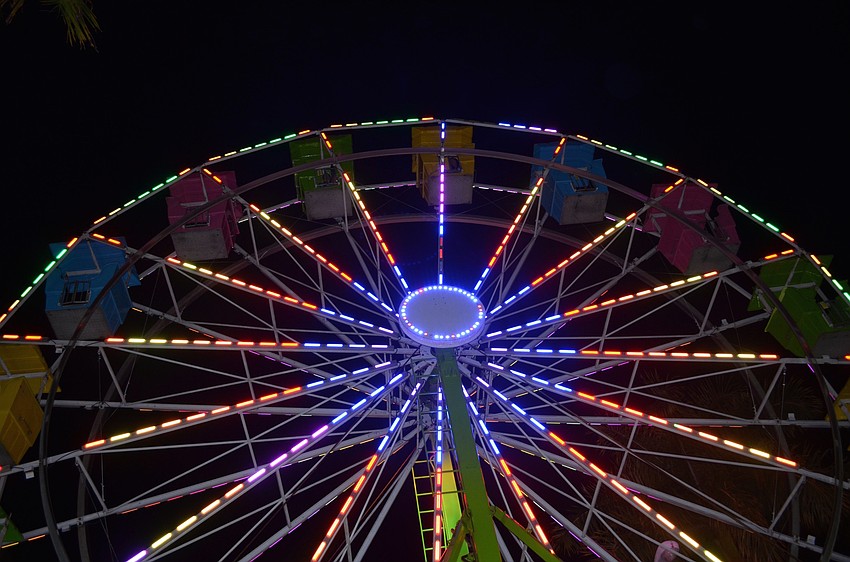 The Ferris wheel rose high above the festivities.