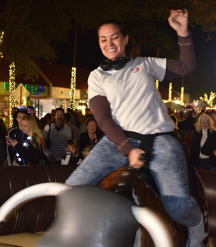 Hazel Young took on the mechanical bull ride on Main Street.