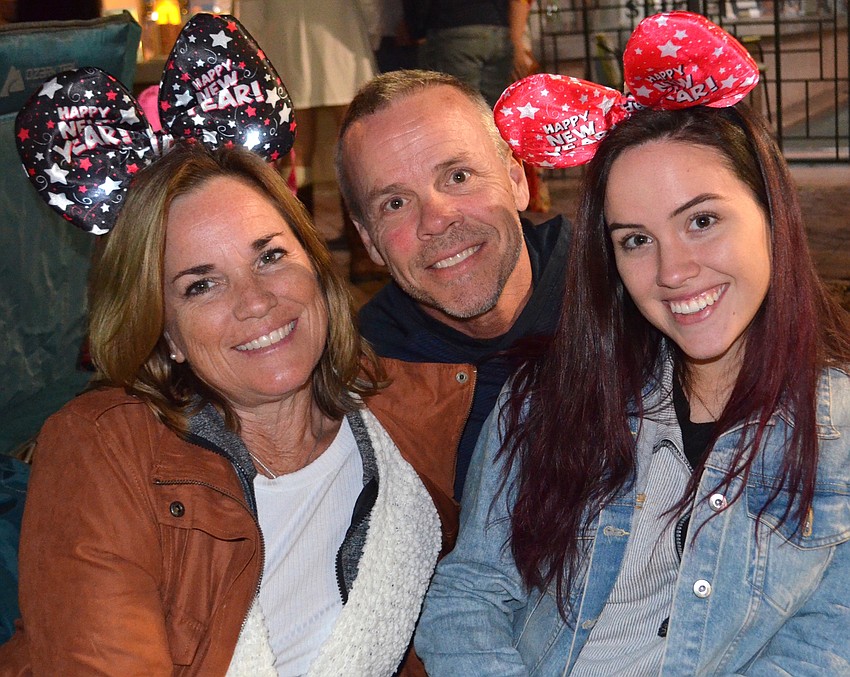 Kelly, Duane and Abby Dunn enjoyed the scene alongside Main Street.
