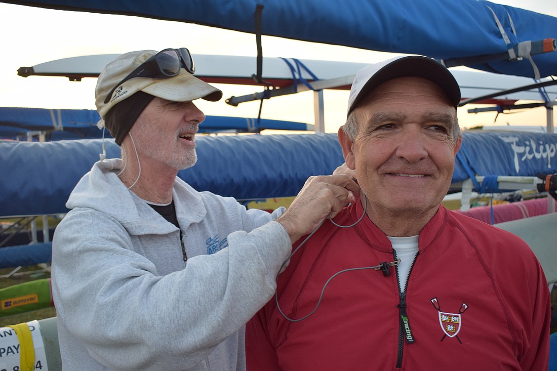 James Mumford wires coach Bob Berry&#39;s audio system before they take the water.