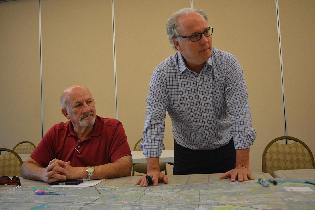 Lakewood Ranch resident Alan Roth watches as consultant Frank Kalpakis of Renaissance Planning, leads a small group through a visioning session at Lakewood Ranch Town Hall in December.