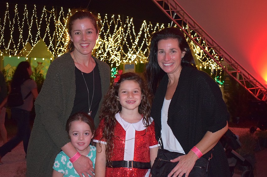 Monica Mancuso and her 5-year-old daughter Marlin visit Sarasota's Marielle Lallo, 8, and her mother, Stephanie. The mothers and daughters were disappointed in the closure of the ice rink but looked forward to riding the tram.