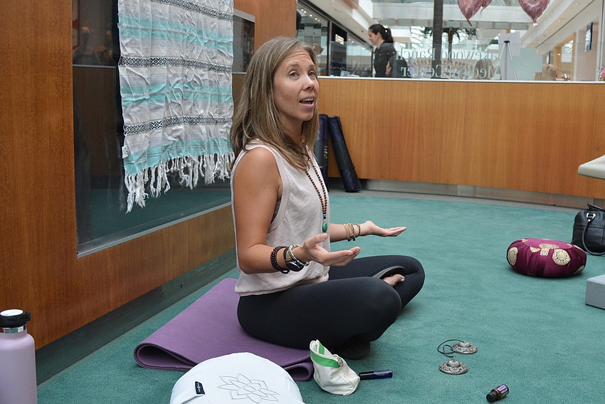 Rebekka Mars leads an exercise in meditation. She asks participants to think about what they enjoy most and what relaxes them. She says she could sit drinking coffee all day.