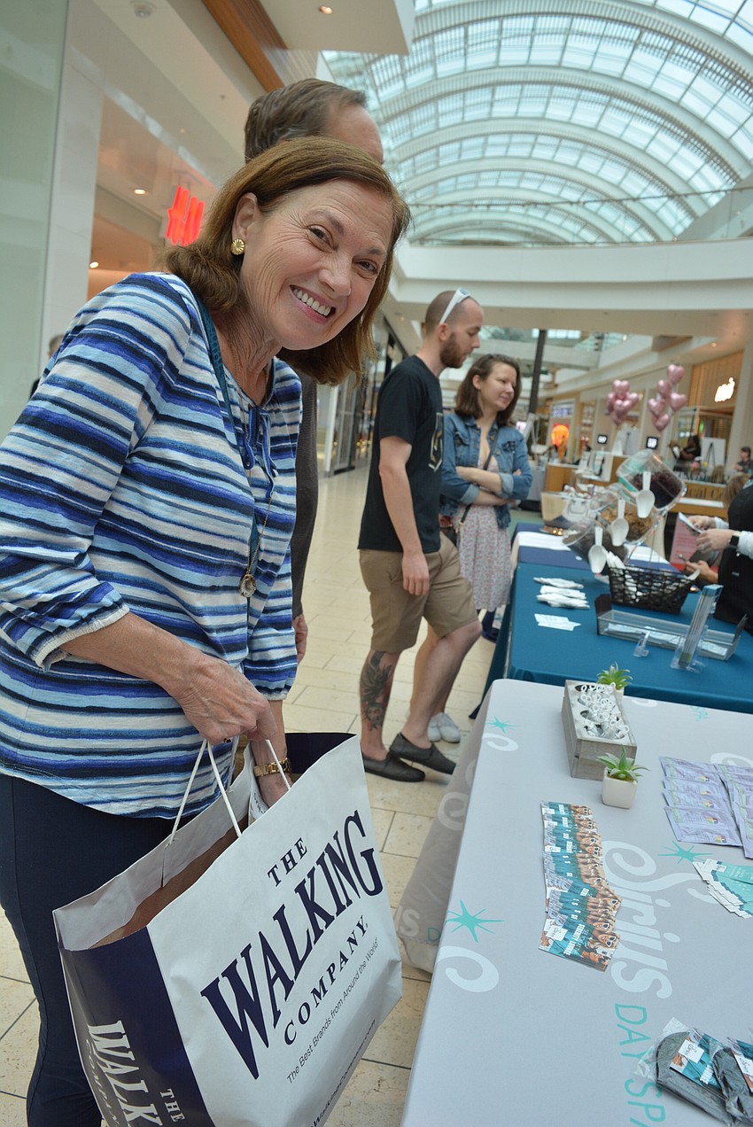University Park's Nancy Ernst visits all the vendor booths with her husband, John Ernst.