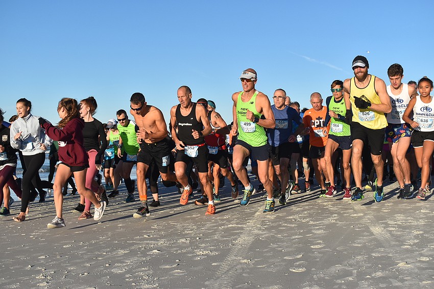The race begins down the beach.