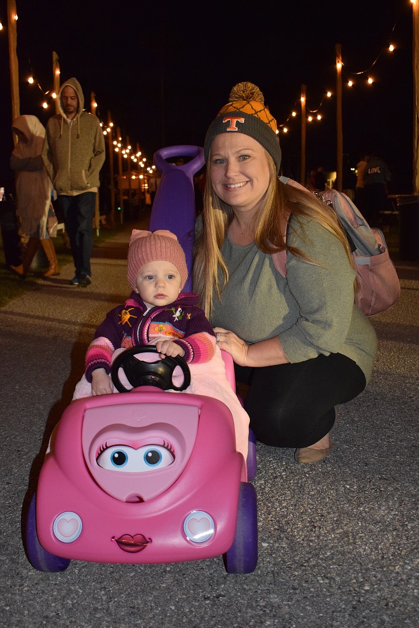 Lakewood Ranch's Jessi Jones pushes her 1-year-old daughter Josie around. Jessi Jones loved the atmosphere at Ranch Nite Wednesday.