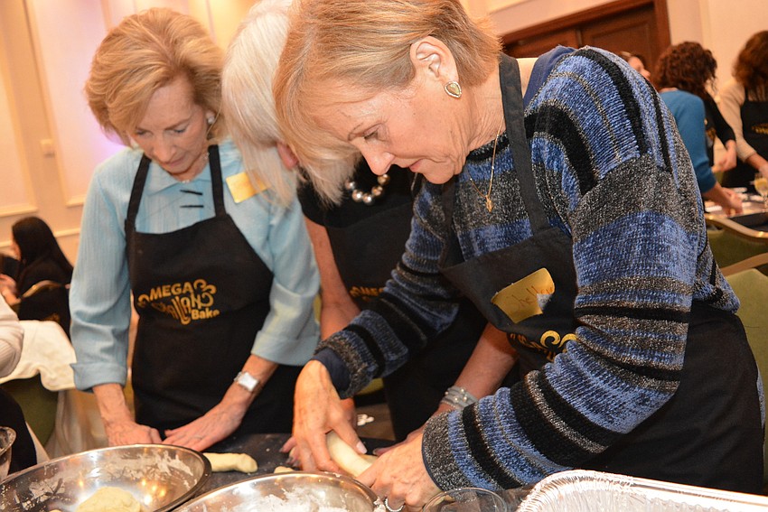 Lakewood Ranch's Toby Simon, Sandie Ivers and Shelly Goldklang work side by side to brain their challah rolls. Ivers is the pro — she makes challah bread every Friday.