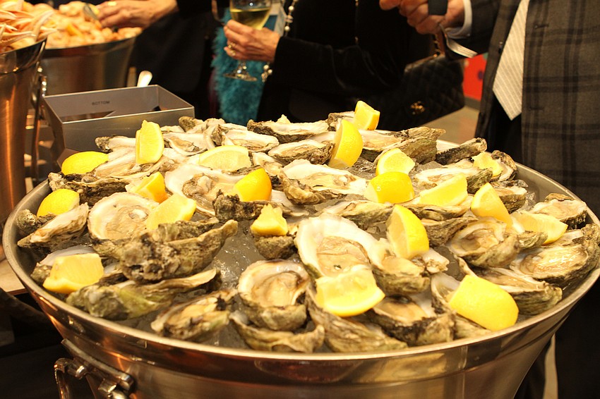 Guests picked up food from the seafood section.