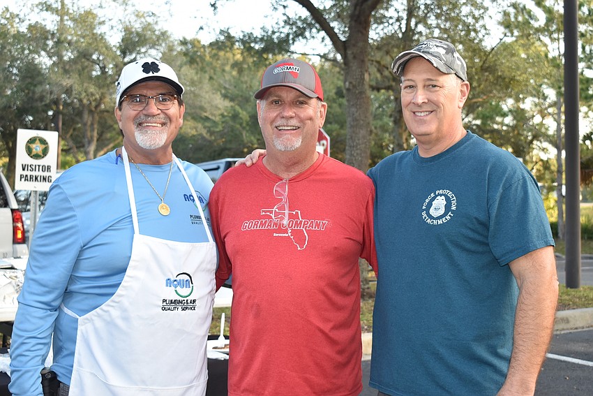 Aqua Plumbing & Air owner Chuck Jacobson, Gorman Company manager Mark Boyer and Sheriff Tom Knight.