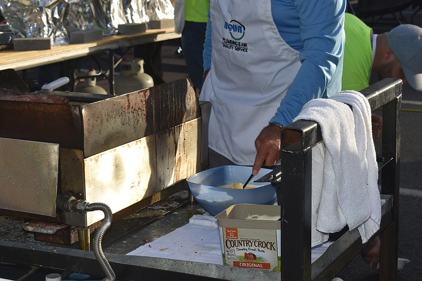Chuck Jacobson mixes more scrambled eggs.