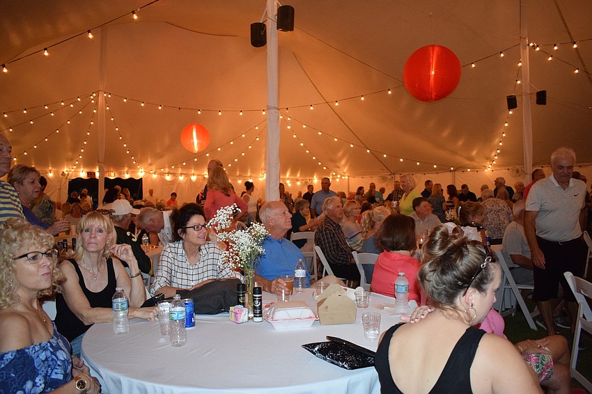 Hundreds of Waterlefe Golf and River Club residents gather to celebrate the community's 20th anniversary. Residents watched a video sharing the community's history.