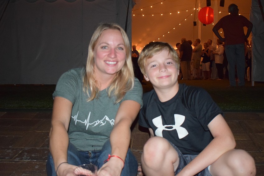 Molly Russo and her 9-year-old son Elijah celebrate the community's anniversary with Russo's parents, Tom and Judy Wemer, who have lived in Waterlefe for 13 years.