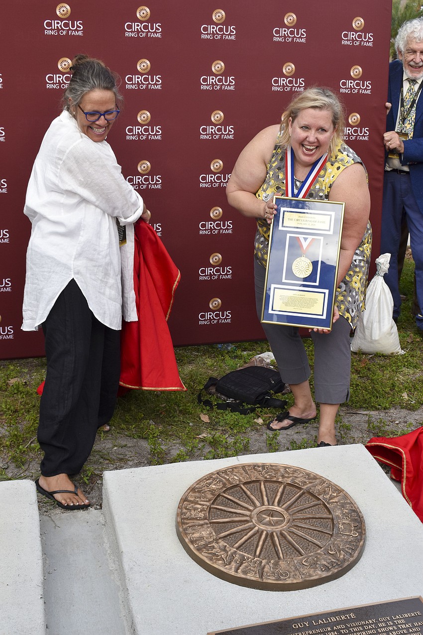 Agathe Ali and Etta Ryan reveal Guy Laliberte, co-founder of Cirque du Soleil, plaque.