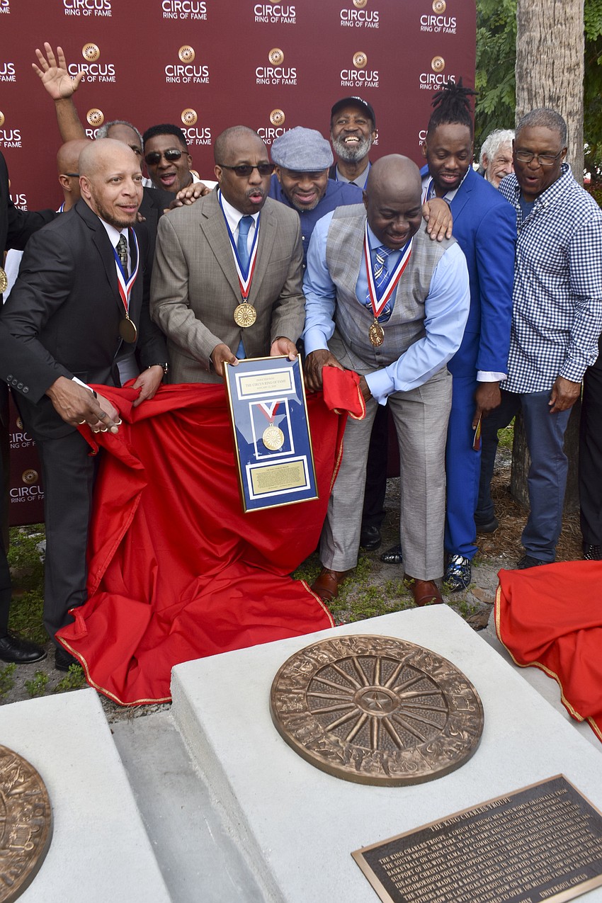 The King Charles Troupe reveals their plaque.