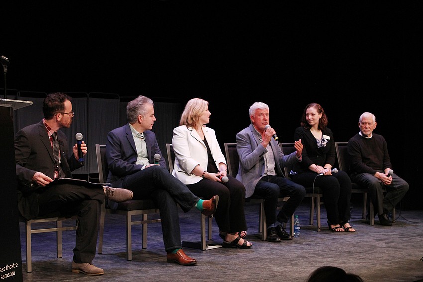 The assembled directors and creators discussing theater and their craft.