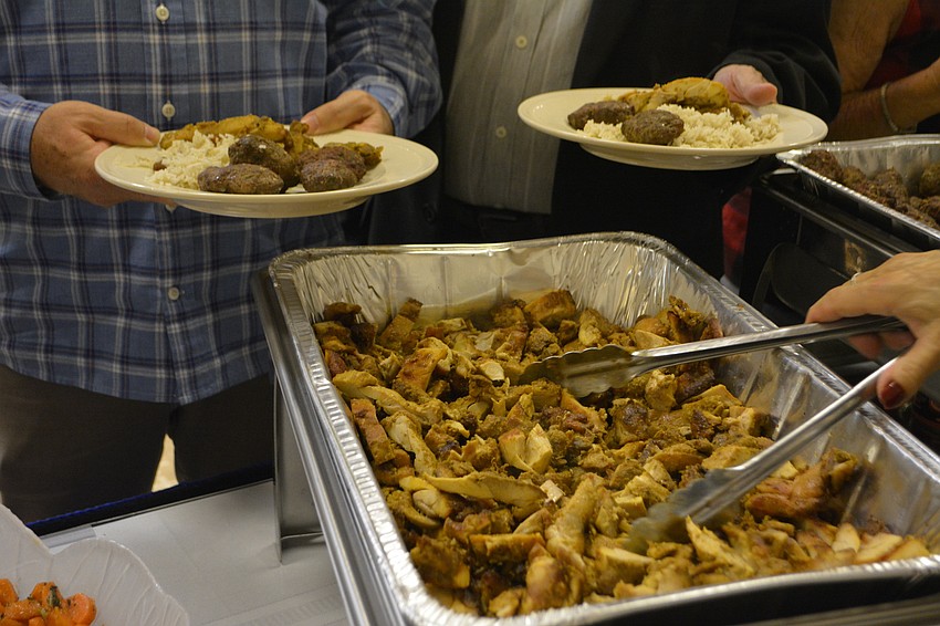 Roasted chicken is served during a Sephardic-style feast Friday night at Temple Beth Israel.