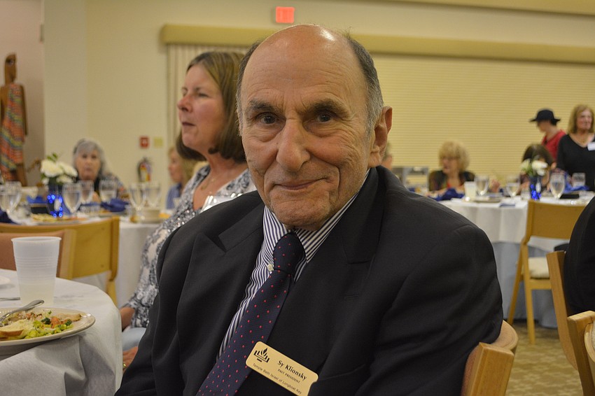 Former Temple Beth Israel president Sy Klionsky poses for a picture during a Sephardic-style feast Friday night at TBI.