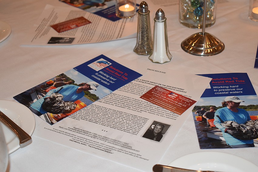 Information about the speakers was available on every table.