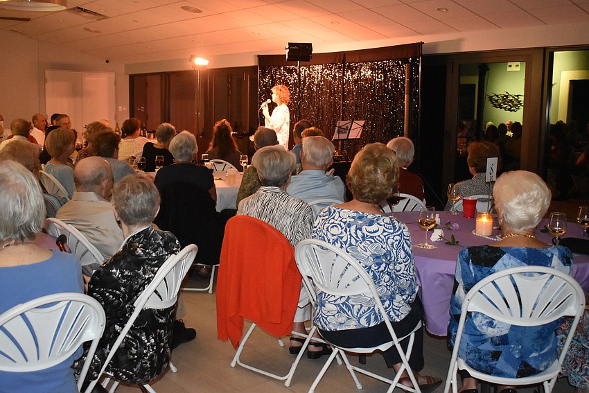Attendees watch Downey's performance.