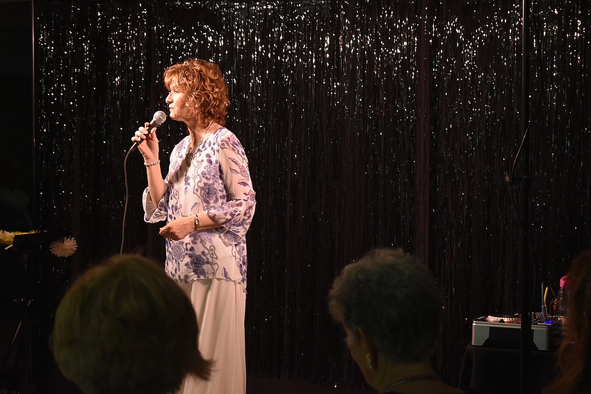 Marcy Downey serenades the crowd.