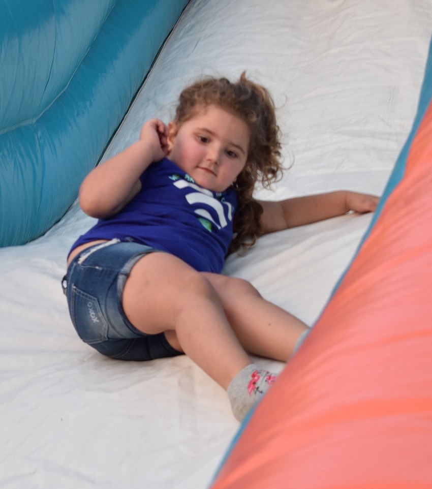 Gianna Fernandez, 3, slides down an inflatable slide. Fernandez enjoyed the Winter Wonderland with her sisters Ayanna, a sixth grader, and Alena, a fourth grader.